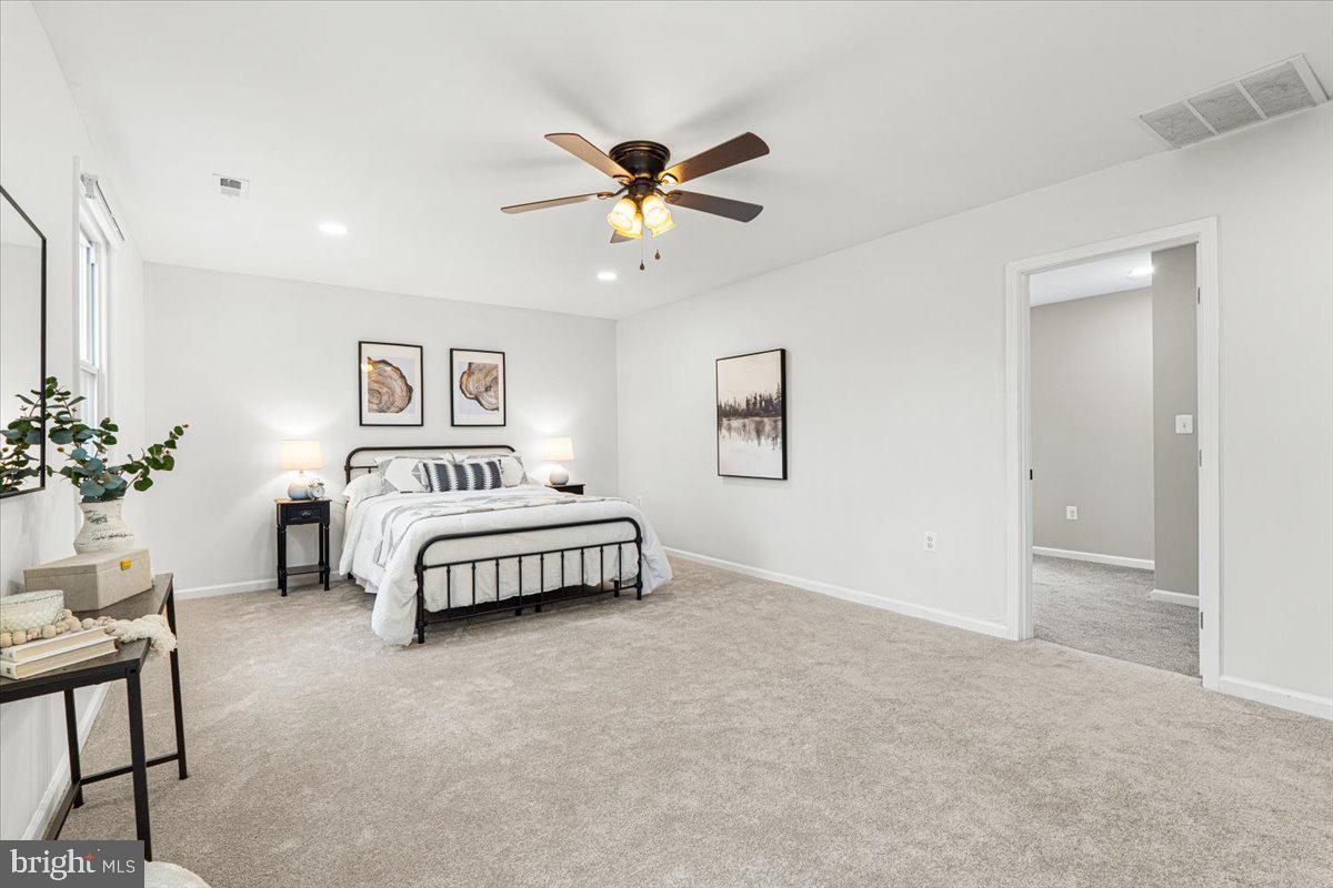 2816 Ballenger Creek Pike Frederick, MD 21703 - Photo 22 of 38 a bedroom with a bed and a chandelier