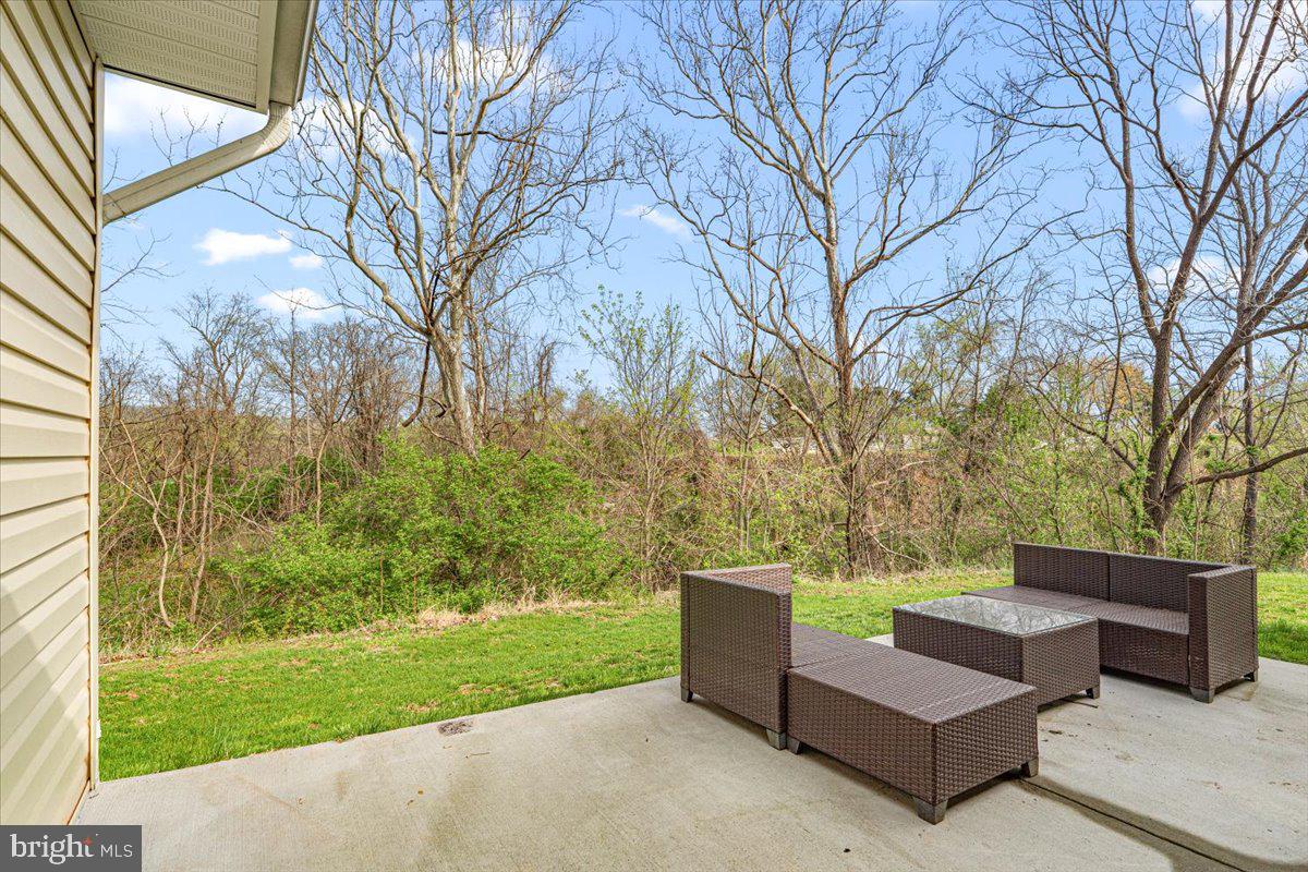 2816 Ballenger Creek Pike Frederick, MD 21703 - Photo 29 of 38 a view of a couches in the patio with a small yard
