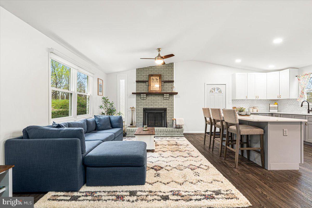 2816 Ballenger Creek Pike Frederick, MD 21703 - Photo 3 of 38 a living room with furniture and a fireplace