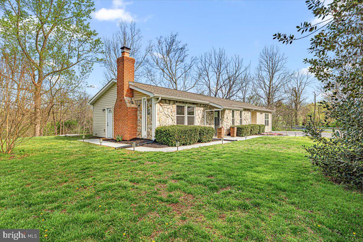2816 Ballenger Creek Pike Frederick, MD 21703 - Photo 32 of 38 a front view of house with yard and green space