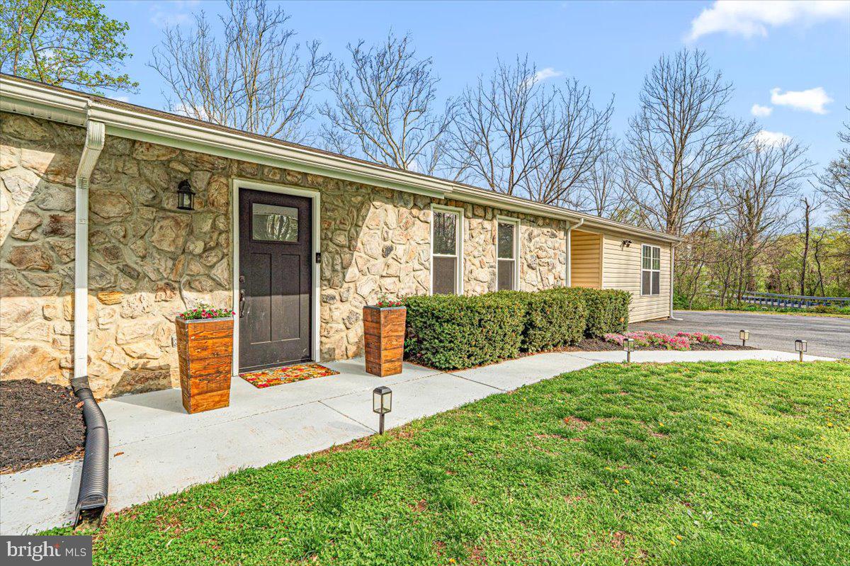 2816 Ballenger Creek Pike Frederick, MD 21703 - Photo 35 of 38 a view of backyard with a garden and plants