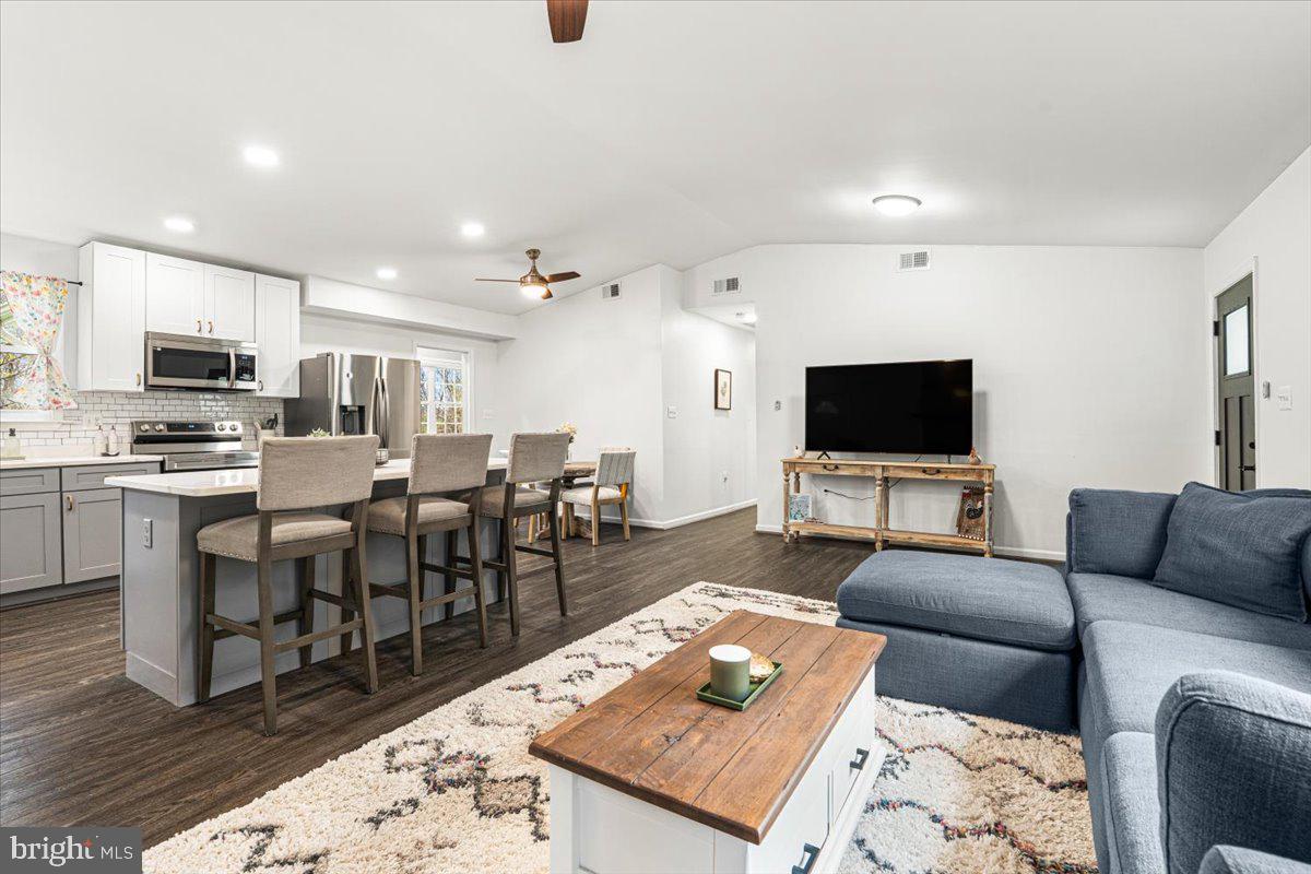 2816 Ballenger Creek Pike Frederick, MD 21703 - Photo 5 of 38 a living room with furniture and a flat screen tv