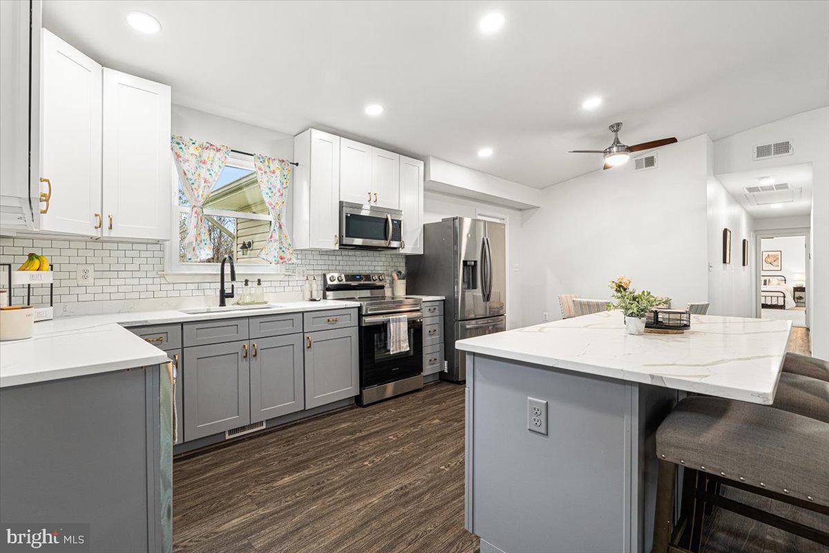 2816 Ballenger Creek Pike Frederick, MD 21703 - Photo 10 of 38 a kitchen with refrigerator cabinets and a sink