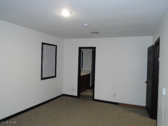 10971 Auburn Road Chardon, OH 44024 - Photo 19 of 40 Empty room with baseboards and light carpet