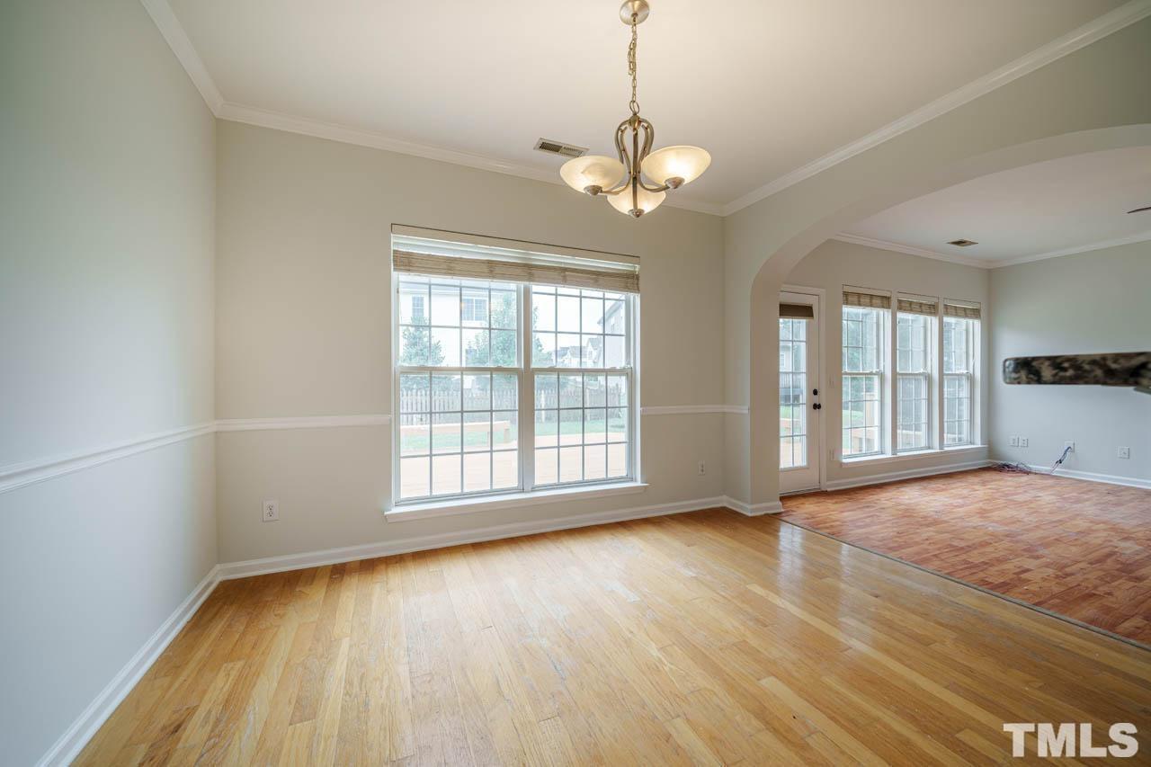 4705 Delta Vision Court, Unit (ID 12461041) Raleigh, NC 27612 - Photo 18 of 35 a view of an empty room with wooden floor and a window