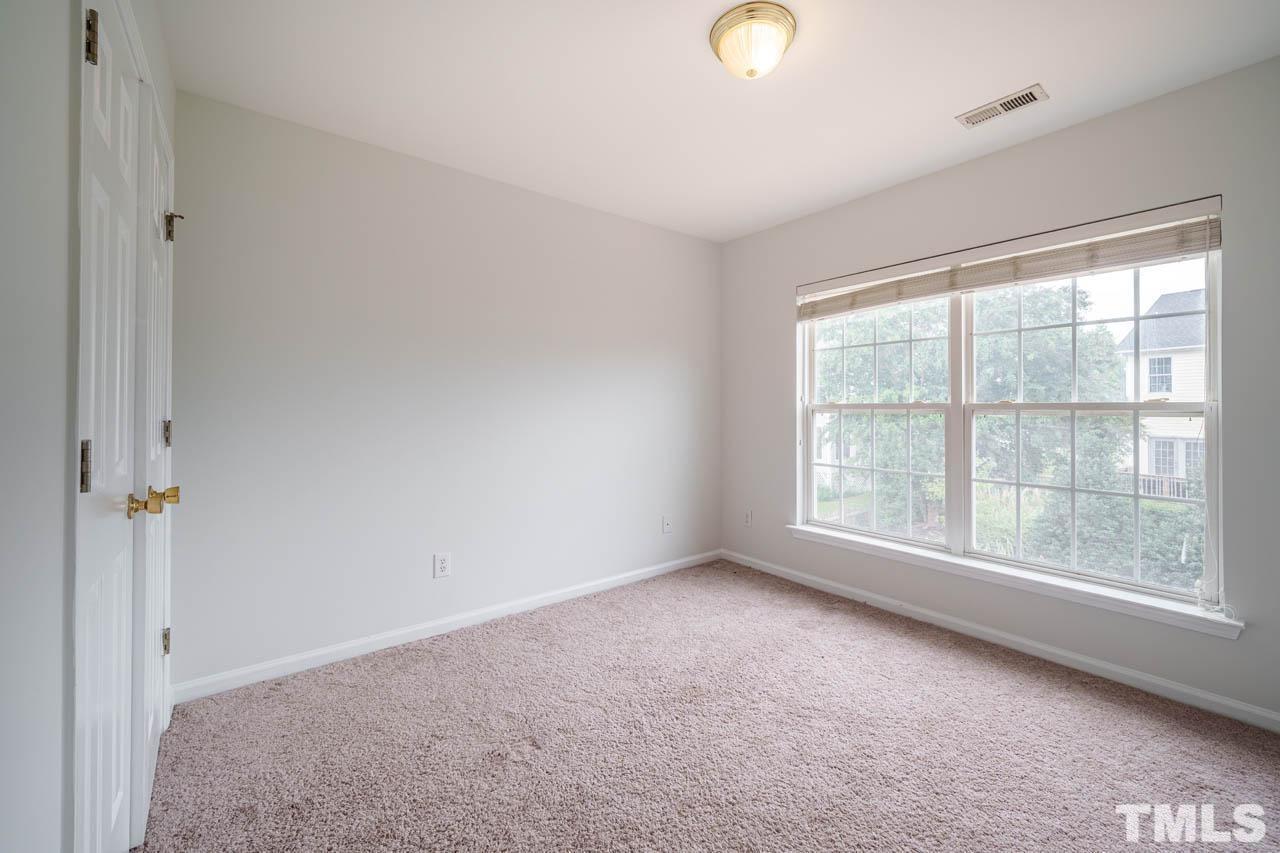 4705 Delta Vision Court, Unit (ID 12461041) Raleigh, NC 27612 - Photo 21 of 35 an empty room with windows