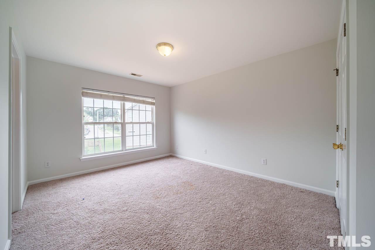 4705 Delta Vision Court, Unit (ID 12461041) Raleigh, NC 27612 - Photo 28 of 35 a view of an empty room with a window