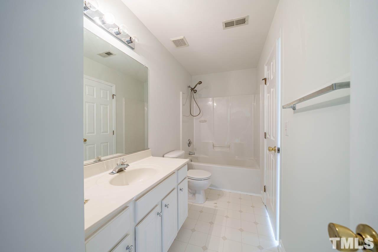 4705 Delta Vision Court, Unit (ID 12461041) Raleigh, NC 27612 - Photo 29 of 35 a bathroom with a sink a toilet and shower