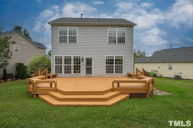 a front view of a house with a yard table and chairs