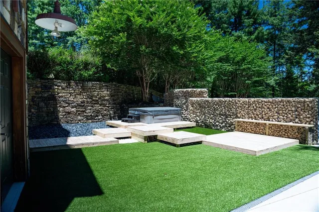 a dining room with furniture a fireplace and wooden floor