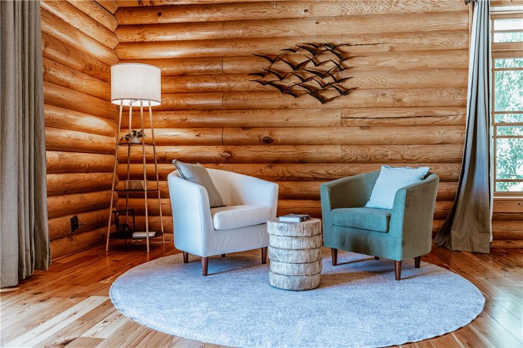 2154 Apple Pie Ridge Road Alto, GA 30510 - Photo 31 of 81 a living room with furniture and wooden floor