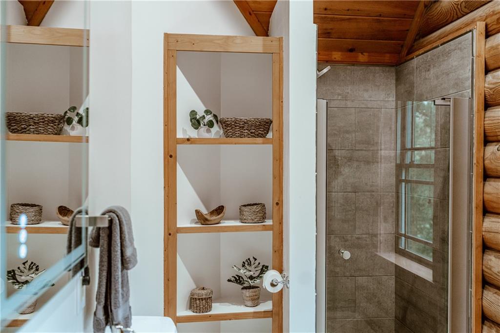 2154 Apple Pie Ridge Road Alto, GA 30510 - Photo 36 of 81 a bathroom with a sink and a mirror