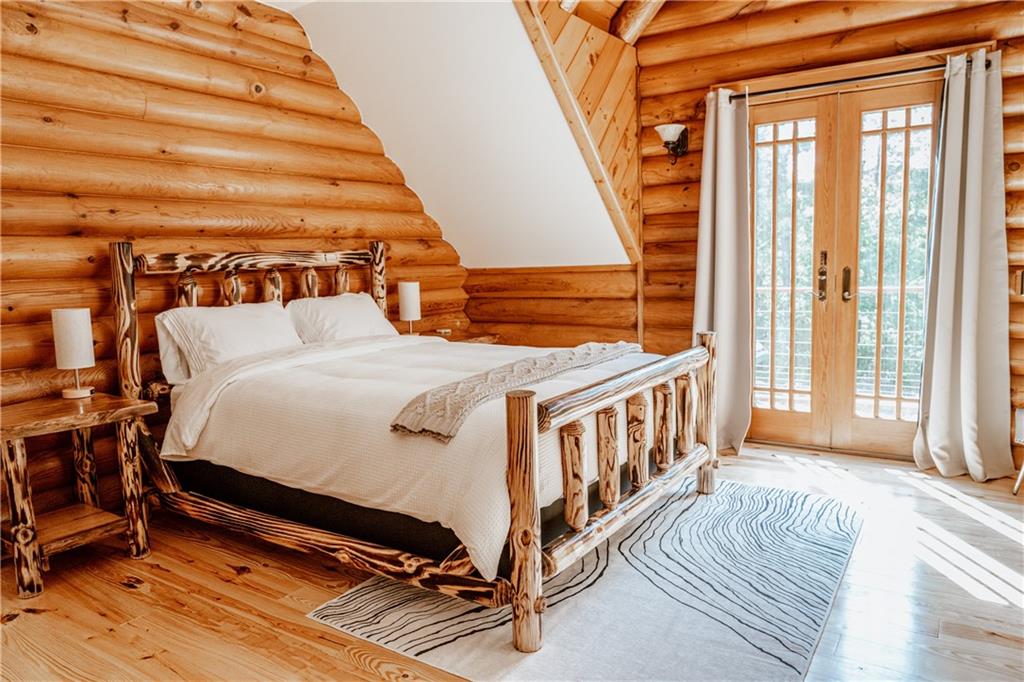 2154 Apple Pie Ridge Road Alto, GA 30510 - Photo 45 of 81 a bedroom with a bed and a large window