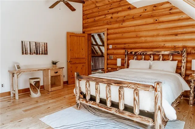 a backyard of a house with wooden floor and outdoor seating