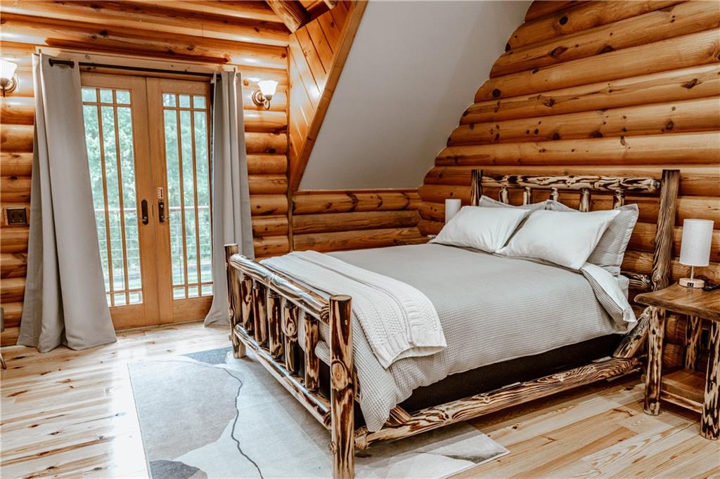 2154 Apple Pie Ridge Road Alto, GA 30510 - Photo 48 of 81 a bed sitting in a bedroom next to a window