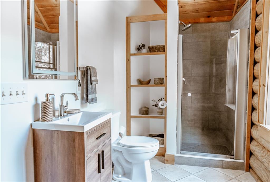 2154 Apple Pie Ridge Road Alto, GA 30510 - Photo 49 of 81 a bathroom with a sink toilet and shower