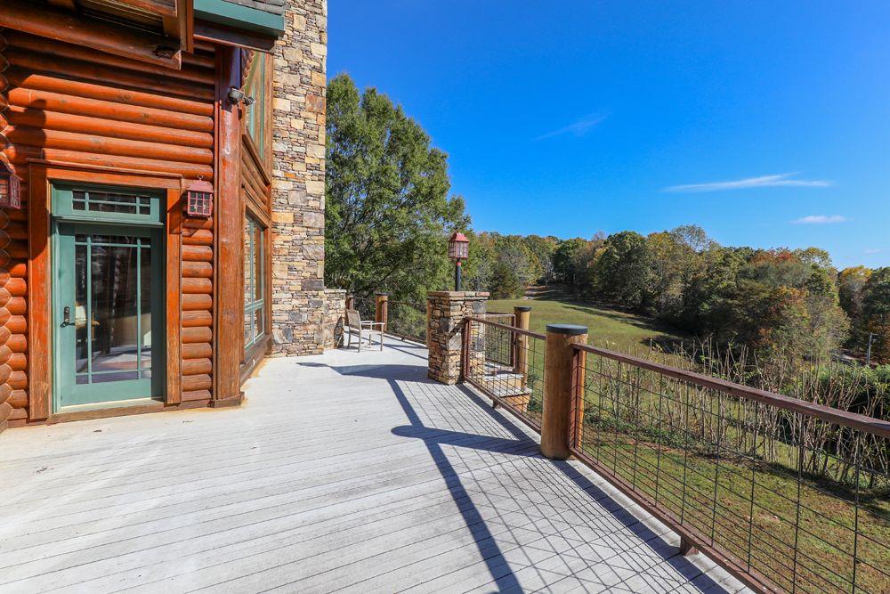 2154 Apple Pie Ridge Road Alto, GA 30510 - Photo 7 of 81 a view of a balcony with wooden floor and fence