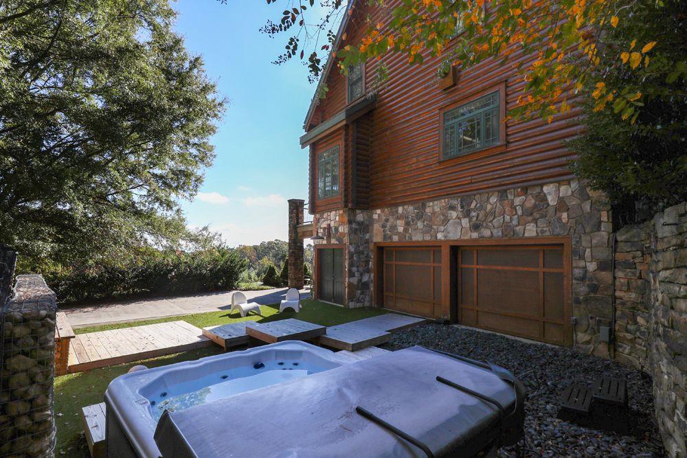 2154 Apple Pie Ridge Road Alto, GA 30510 - Photo 75 of 81 a backyard of a house with wooden floor and outdoor seating