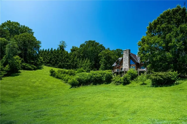 a view of a patio with table and chairs