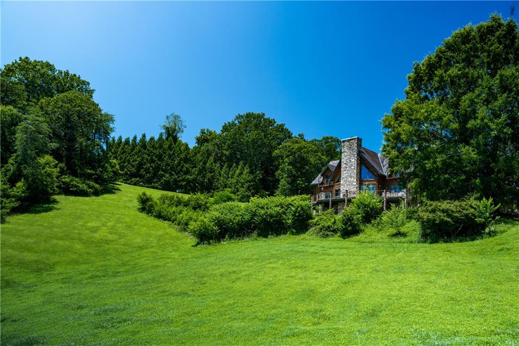 2154 Apple Pie Ridge Road Alto, GA 30510 - Photo 9 of 81 a view of a garden with a building in the background