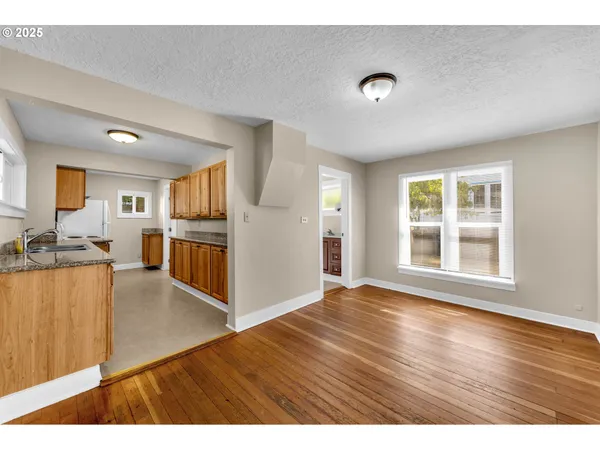 a view interior of kitchen and hall with wooden floor