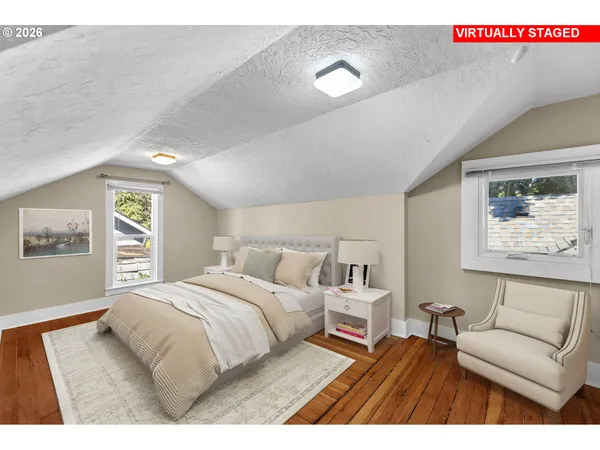 a bedroom with a large bed and a couch