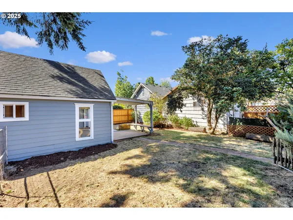 a view of a backyard with a house