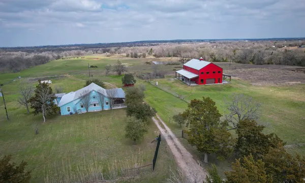 swimming pool view with a seating space