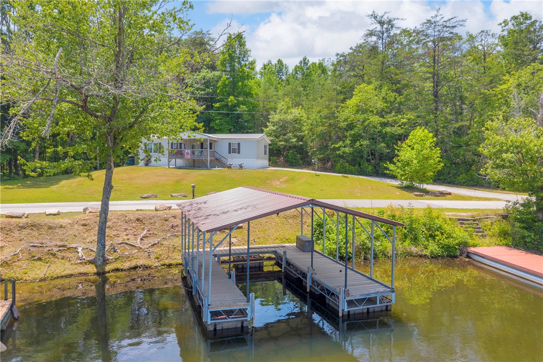 334 Lake Becky Road Mountain Rest, SC 29664 - Photo 30 of 46 Boathouse with a private dock offers direct lake access and serene views.