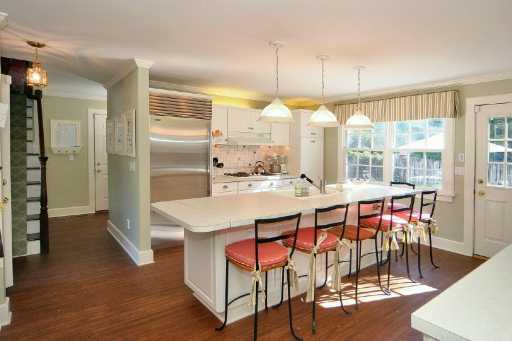 Undisclosed Address Darien, CT 06820 - Photo 5 of 5 a large kitchen with a table and chairs