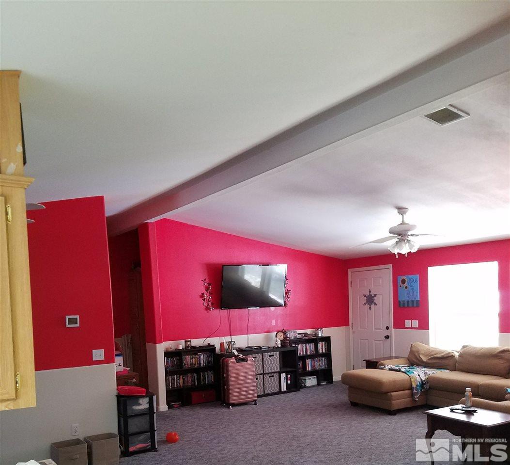 4736 Alcorn Road Fallon, NV 89406 - Photo 2 of 11 a living room with furniture and a flat screen tv