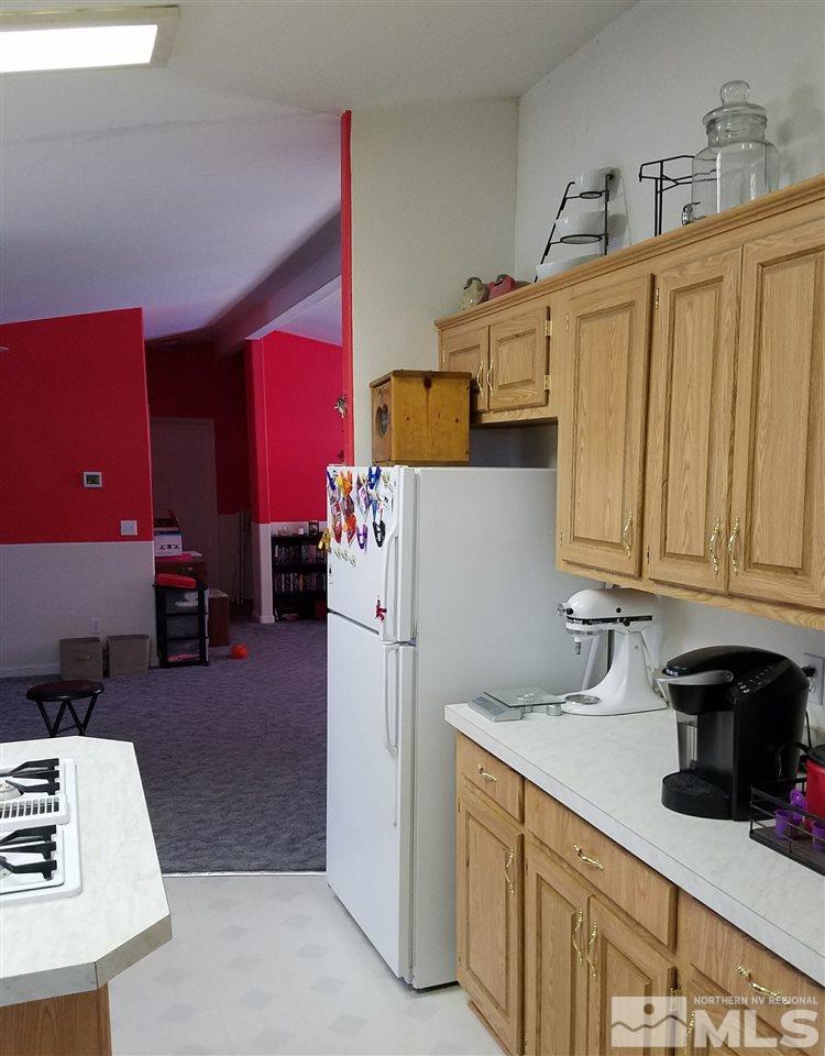 4736 Alcorn Road Fallon, NV 89406 - Photo 4 of 11 a kitchen with refrigerator and cabinets
