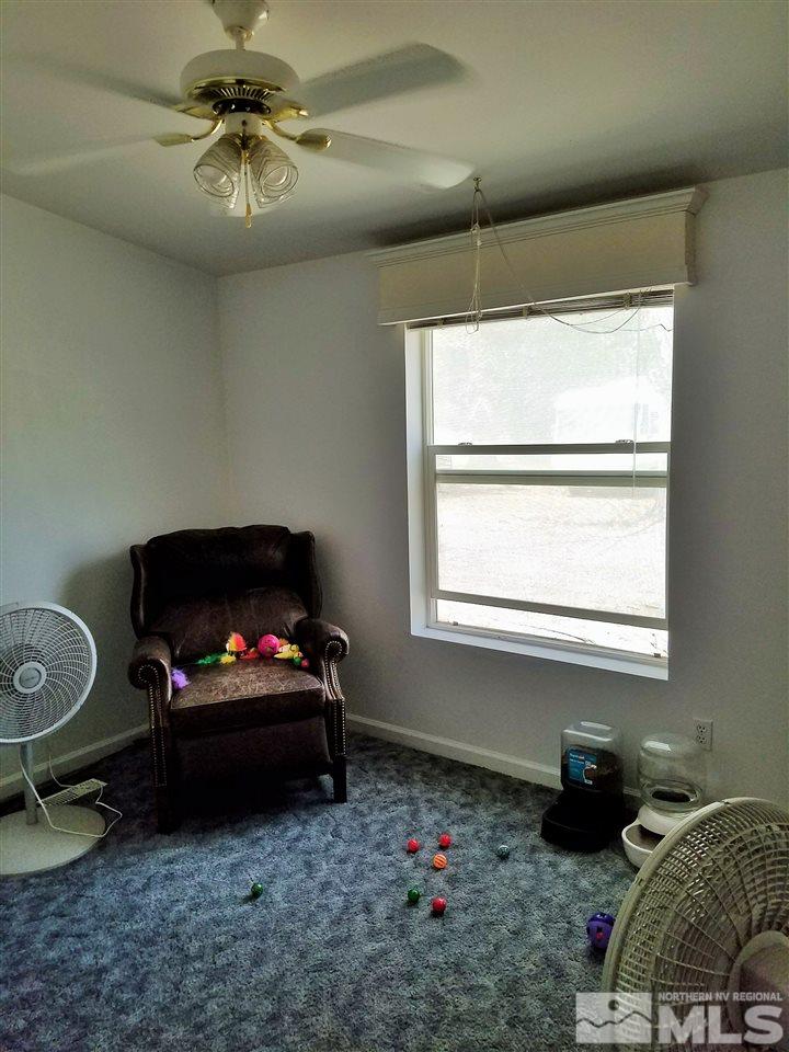 4736 Alcorn Road Fallon, NV 89406 - Photo 7 of 11 a living room with furniture and a flat screen tv