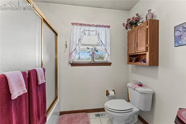 a bedroom with a bed and a table in it