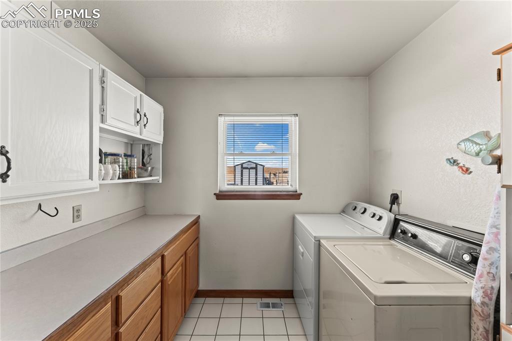 9330 Berridge Road Calhan, CO 80808 - Photo 30 of 50 a utility room with dryer and washer