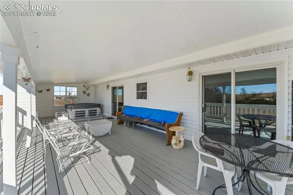 a view of a balcony with wooden floor