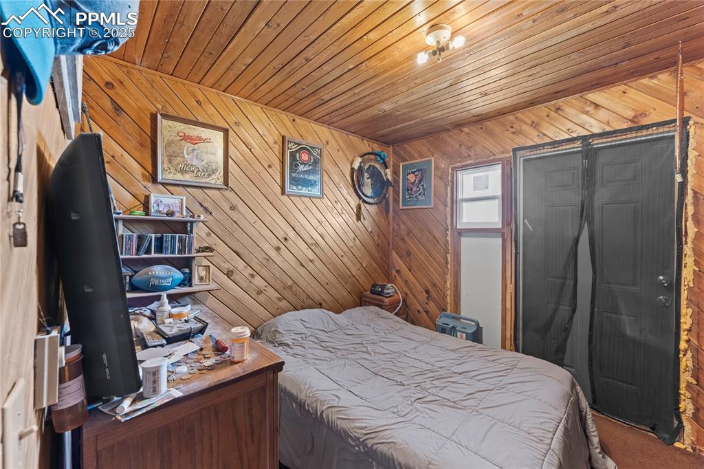 9330 Berridge Road Calhan, CO 80808 - Photo 44 of 50 a bedroom with a bed and a window