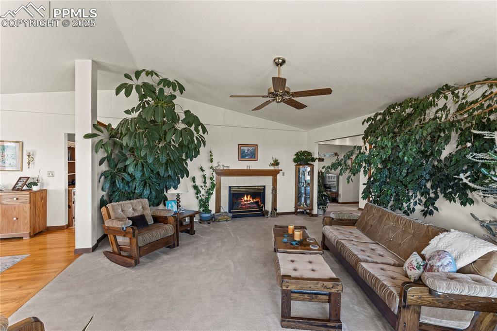 9330 Berridge Road Calhan, CO 80808 - Photo 5 of 50 a living room with furniture and a fireplace