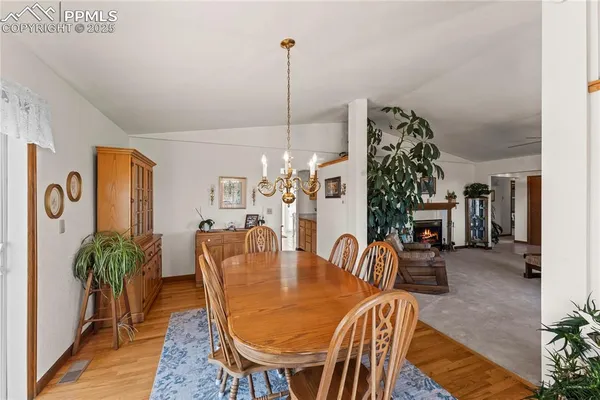a view of a livingroom with furniture wooden floor and a rug