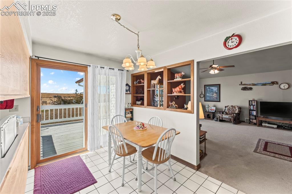 9330 Berridge Road Calhan, CO 80808 - Photo 9 of 50 a view of a livingroom with furniture wooden floor and a rug