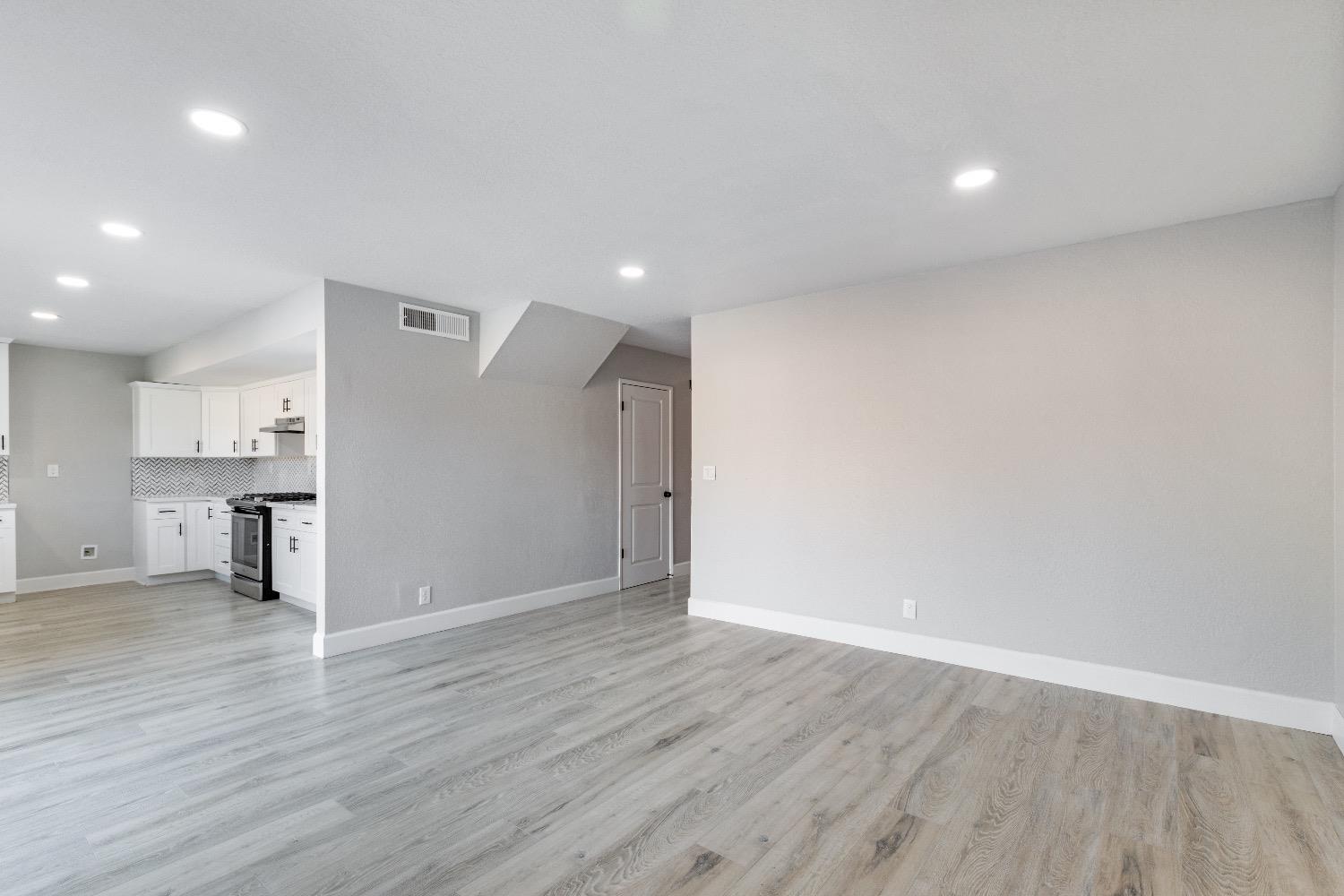 1053 Menlo Avenue Clovis, CA 93612 - Photo 12 of 41 a view of an empty room with wooden floor