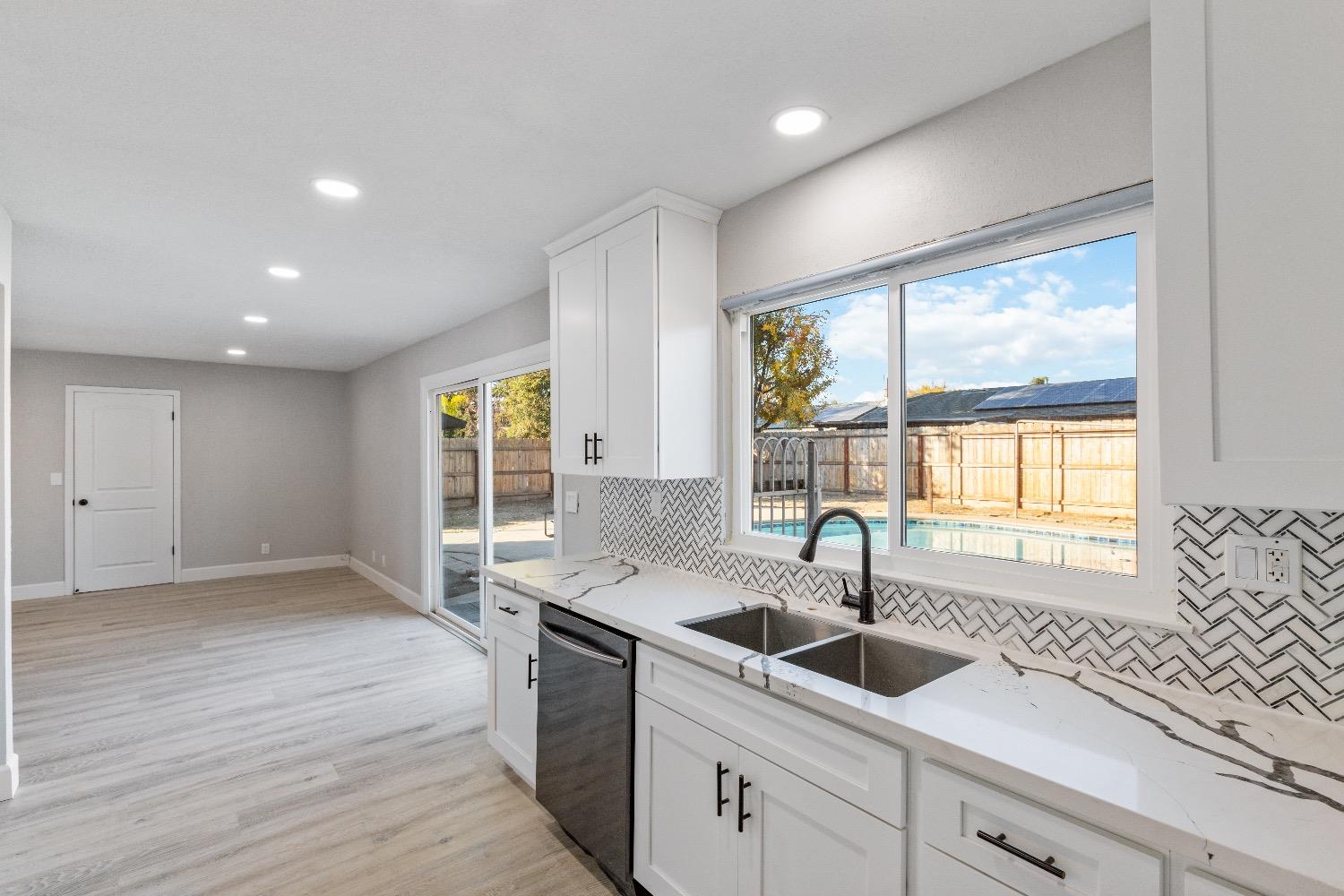 1053 Menlo Avenue Clovis, CA 93612 - Photo 13 of 41 a kitchen with a sink and large window