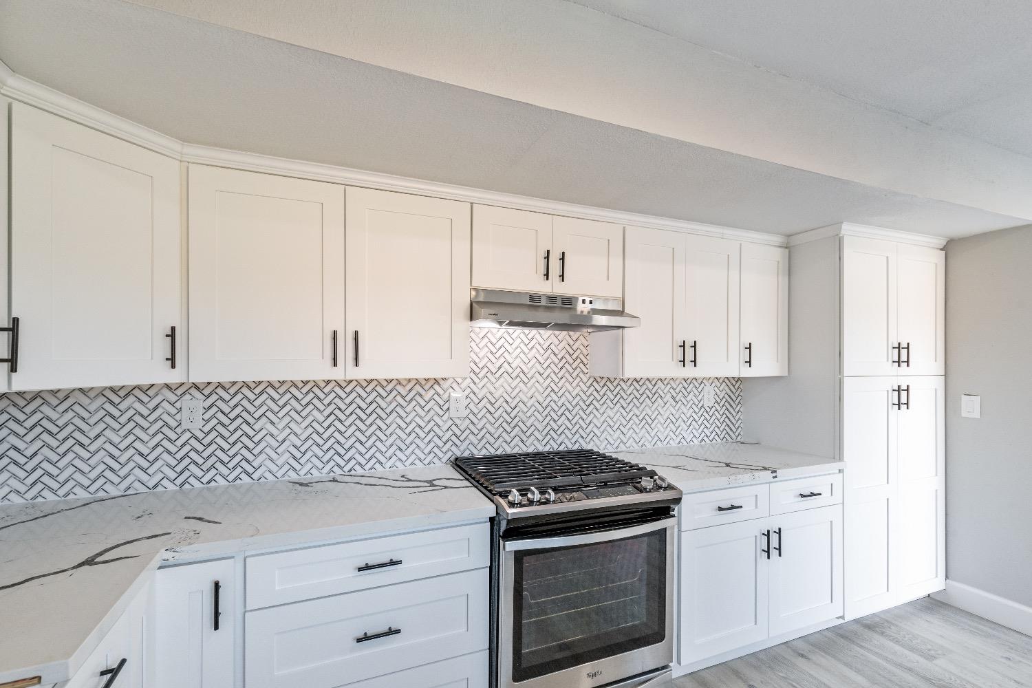 1053 Menlo Avenue Clovis, CA 93612 - Photo 16 of 41 a kitchen with cabinets and appliances