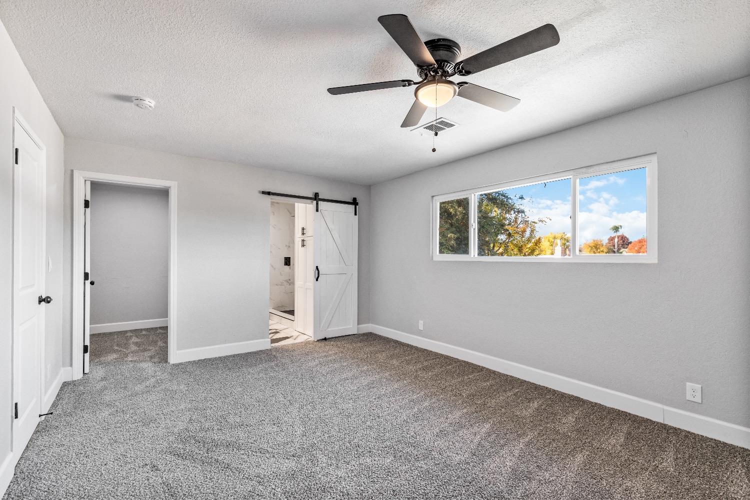 1053 Menlo Avenue Clovis, CA 93612 - Photo 18 of 41 a view of an empty room with a ceiling fan