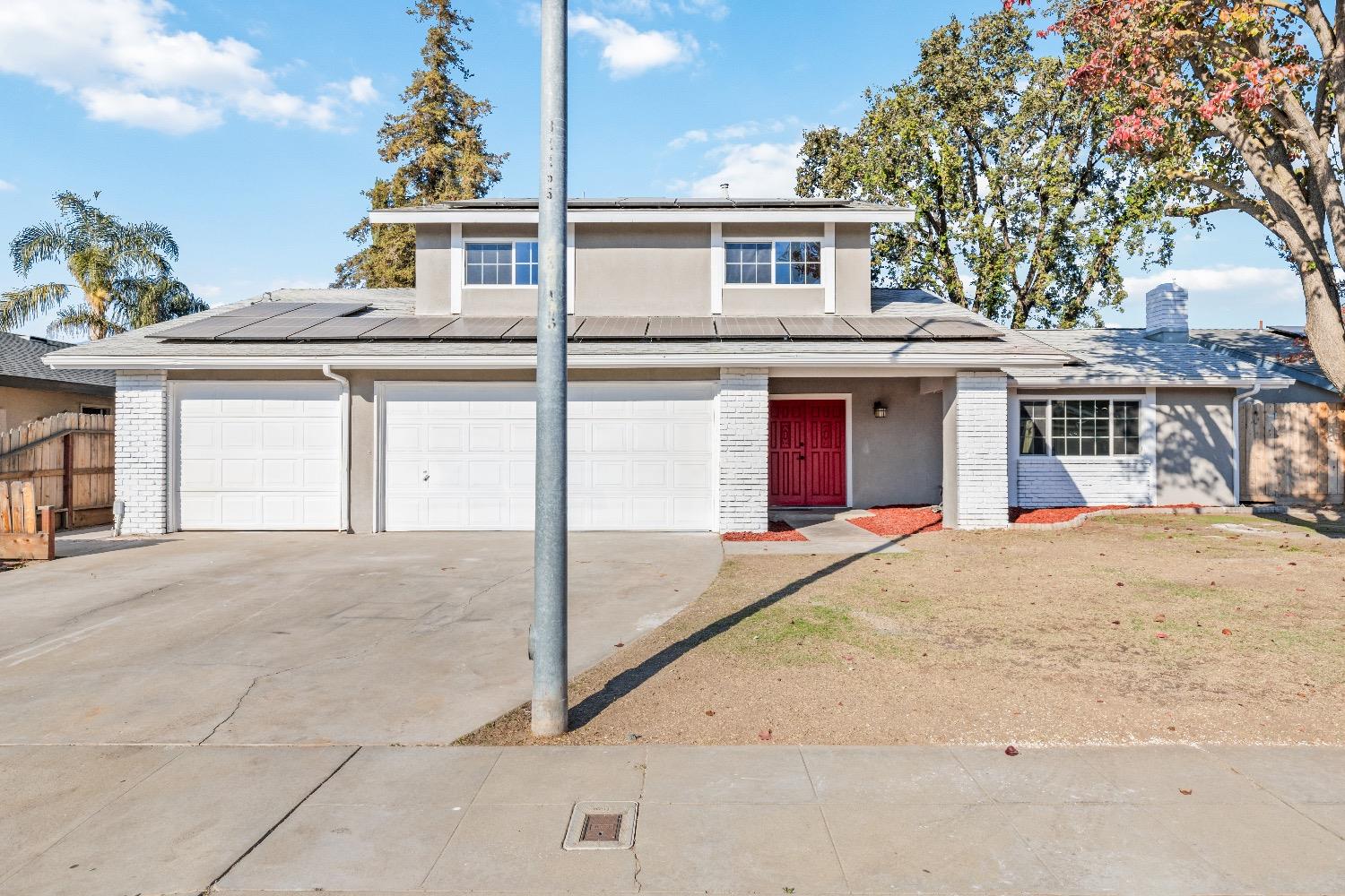 1053 Menlo Avenue Clovis, CA 93612 - Photo 2 of 41 front view of a house with a street