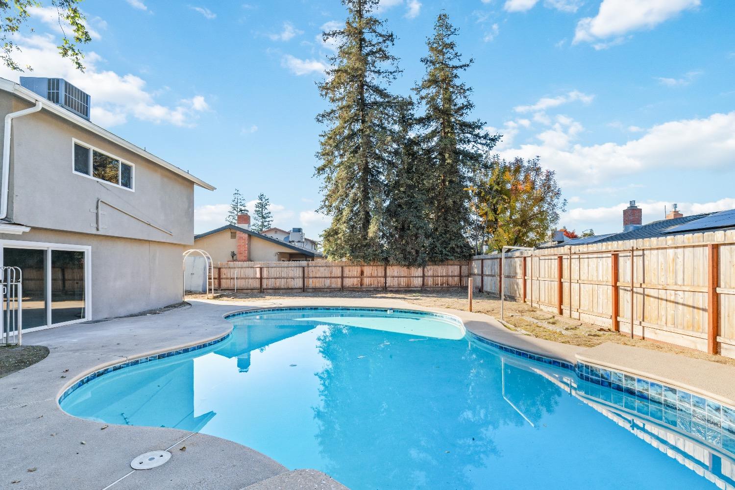 1053 Menlo Avenue Clovis, CA 93612 - Photo 30 of 41 a view of a house with swimming pool