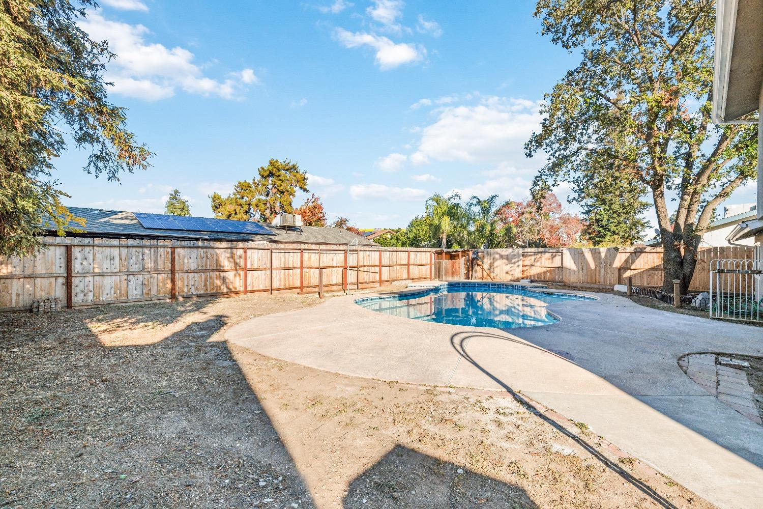 1053 Menlo Avenue Clovis, CA 93612 - Photo 31 of 41 a view of a swimming pool with a lounge chair