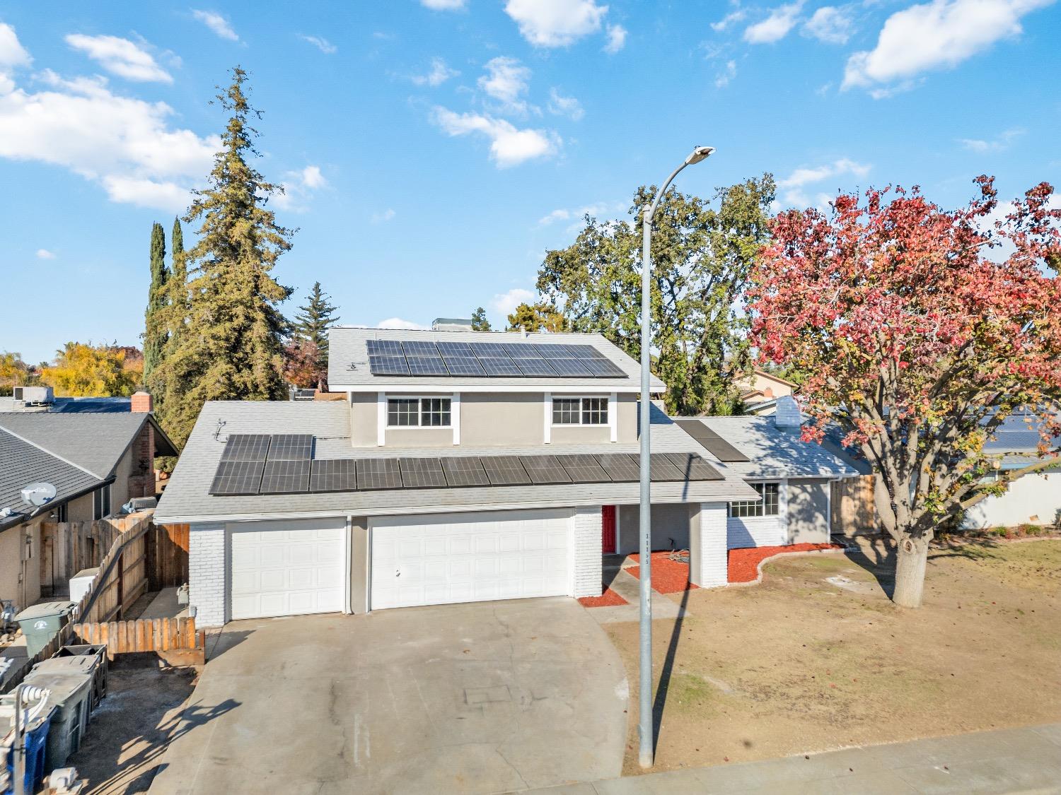 1053 Menlo Avenue Clovis, CA 93612 - Photo 5 of 41 a view of a house with a snow in a yard