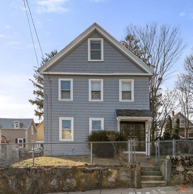 48 Cedar Street Boston, MA 02126 - Photo 1 of 32 a front view of a house with garden