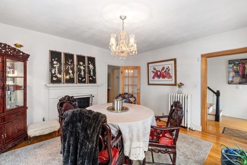 48 Cedar Street Boston, MA 02126 - Photo 13 of 32 a view of a dining room with furniture and chandelier